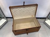 an open suitcase sitting on the floor next to other suitcases