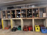 many bottles of wine on the shelves in the garage