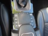a cell phone in the center console of a car