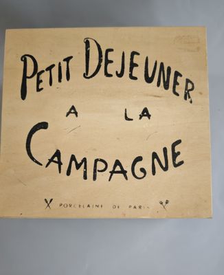 un panneau sur lequel est écrit « petit dîner à la campagne »