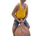 a clay sculpture of a boy sitting on a bag