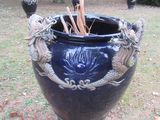 a large blue vase with a dragon decoration on it