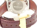 an image of a close up of a wrist watch on a white surface