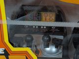a toy truck that is in a box with a remote control