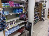 many shelves in the store that have various items on them