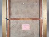 an old picture of a wooden frame with a pink label on it