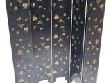 an image of a black and gold room divider with flowers on it