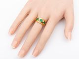 a close up of a person ' s hand with a ring on it