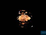 a close up of a ring on a table with a black background