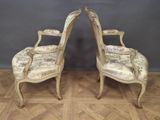 pair of french louis xv style armchairs with upholstered arms