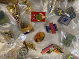 a pile of pins and other items that are on a table