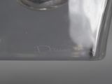 a close up view of a glass vase with a silver lid