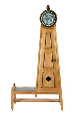 a wooden grandfather clock on a shelf with a clock on it