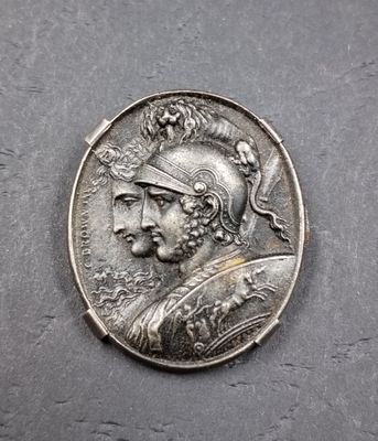 une pièce d'argent à l'effigie d'un homme portant un casque