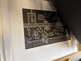 a black and white drawing on the wall of a room