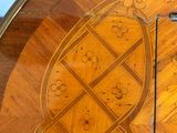 an image of a wooden table with a clock on top of it