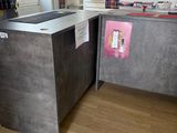 a counter in a store with a lot of items on the shelves