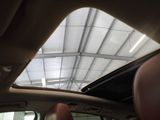 a view of the sunroof from inside of a car