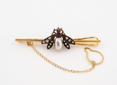 an image of a pearl and diamond butterfly broochle with a gold chain