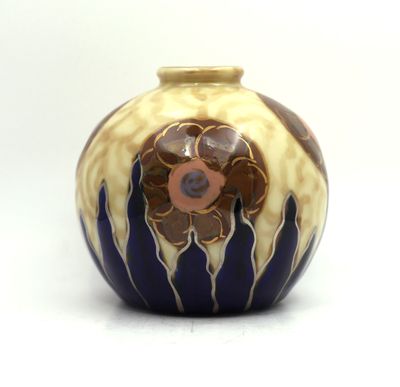 a blue and yellow vase with a flower on it
