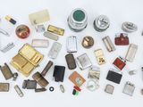 many different types of lighters and lighters on the table