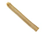 gros plan d'un bracelet en or sur fond blanc