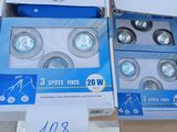 several boxes of light bulbs sitting on top of a cardboard box