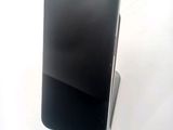 a cell phone that is sitting on top of a stand
