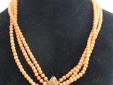 a close up of a necklace on a mannequin mannequin