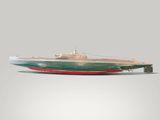 a model of a small boat on a white surface