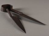 a pair of scissors that are on a table