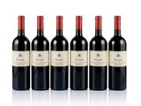 four bottles of red wine are lined up in a row