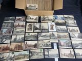 a box full of old postcards sitting on a table
