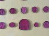 a picture of a wall with a lot of pink coins