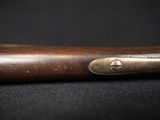 an old baseball bat on a black surface