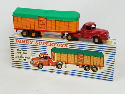 two toy trucks that are sitting on top of a box