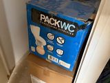 a blue box sitting on top of a cardboard box in a room
