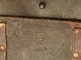 a close up of a piece of metal with rivets on it