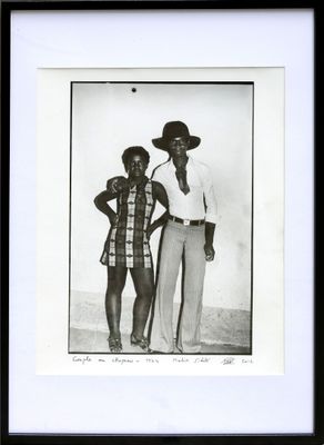 an old black and white photo of two men and a woman