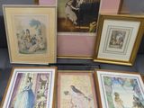 several framed pictures of people and birds on display in a glass case