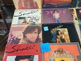 a lot of records on a table in a store