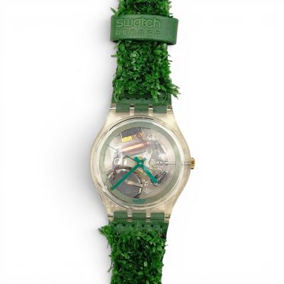 an image of a close up of a wrist watch on a white surface