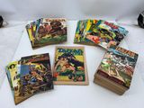 a bunch of comics sitting on top of a table next to each other