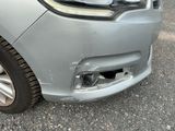 a close up of a car that has a denting on it