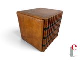 an image of a stack of books sitting on top of a wooden table