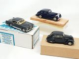 three toy cars that are on display in a box