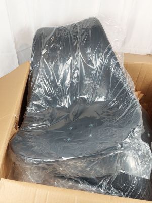a cardboard box with a black chair in it