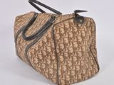 brown and black handbag with monogram print on it