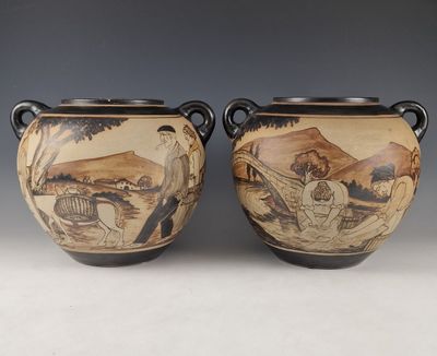 pair of vases with a painting of a man and woman in a landscape