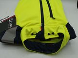 a yellow vest that has a black zipper on it